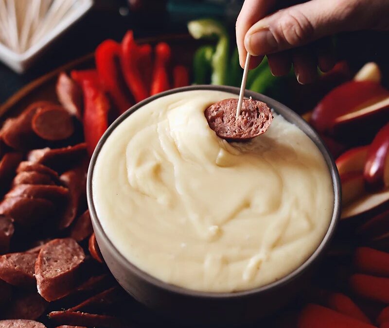 Gluten-free cheese fondue with grass-fed beef sausage & vegetable dippers